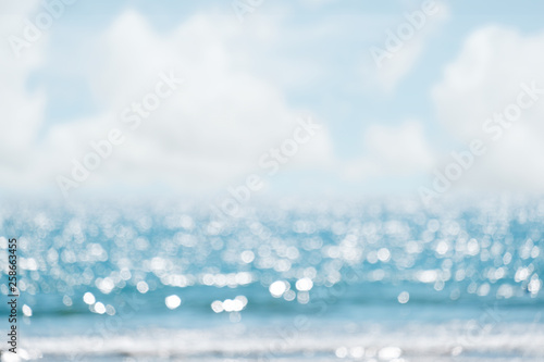 Fototapeta Naklejka Na Ścianę i Meble -  Seascape abstract beach background. blur bokeh light of calm sea and sky.