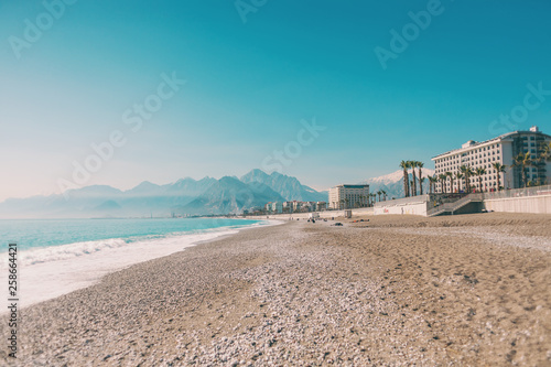 Ocean waves and coastal sand. © zhukovvvlad