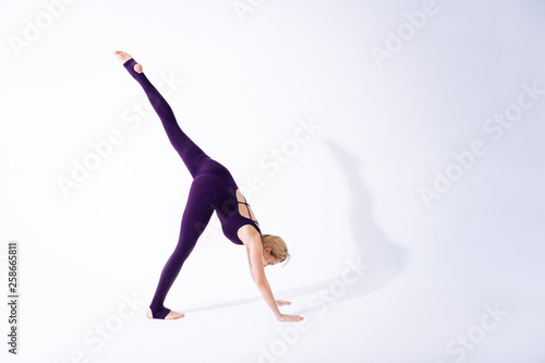 Attractive fit woman doing a gymnastic exercise