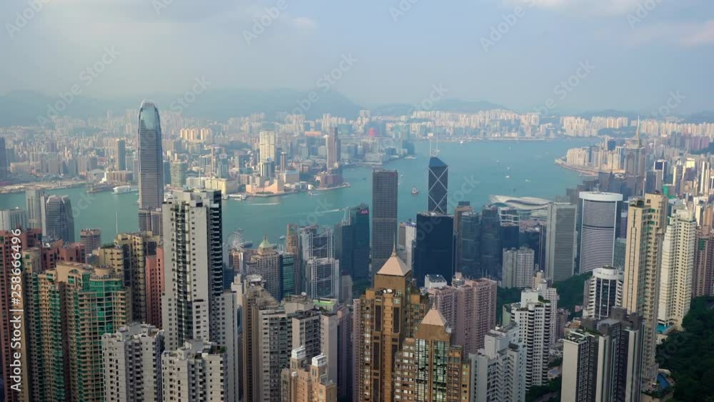 Aerial panoramic pan shot of Hong Kong skyline, Harbor and Macao, sunny blue sky weather and far sight to the horizon Aerial panoramic pan shot of Hong Kong skyline, Harbor and Macao, sunny blue sky weather and far sight to the horizon