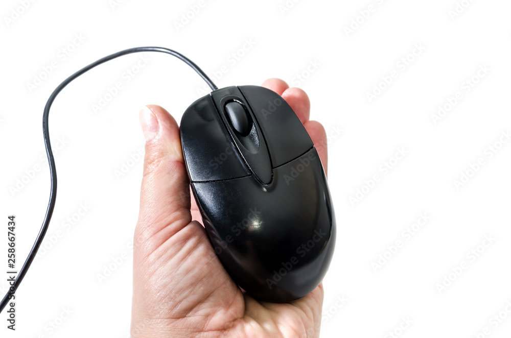 black computer mouse in female hand isolated on white background black computer mouse in female hand isolated on white background
