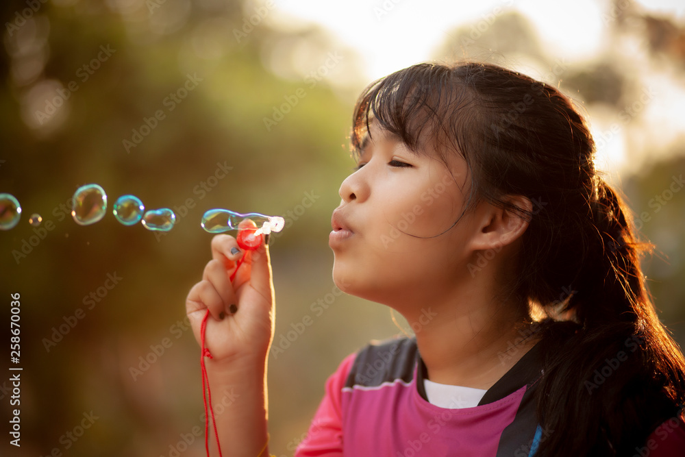 asian teenager relaxing with soup bubble against beautiful sun light asian teenager relaxing with soup bubble against beautiful sun light