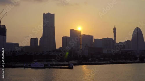 Yokohama Sunset Cityscape Zoom Out Footage With Skyscrapers Towers and Sea photo