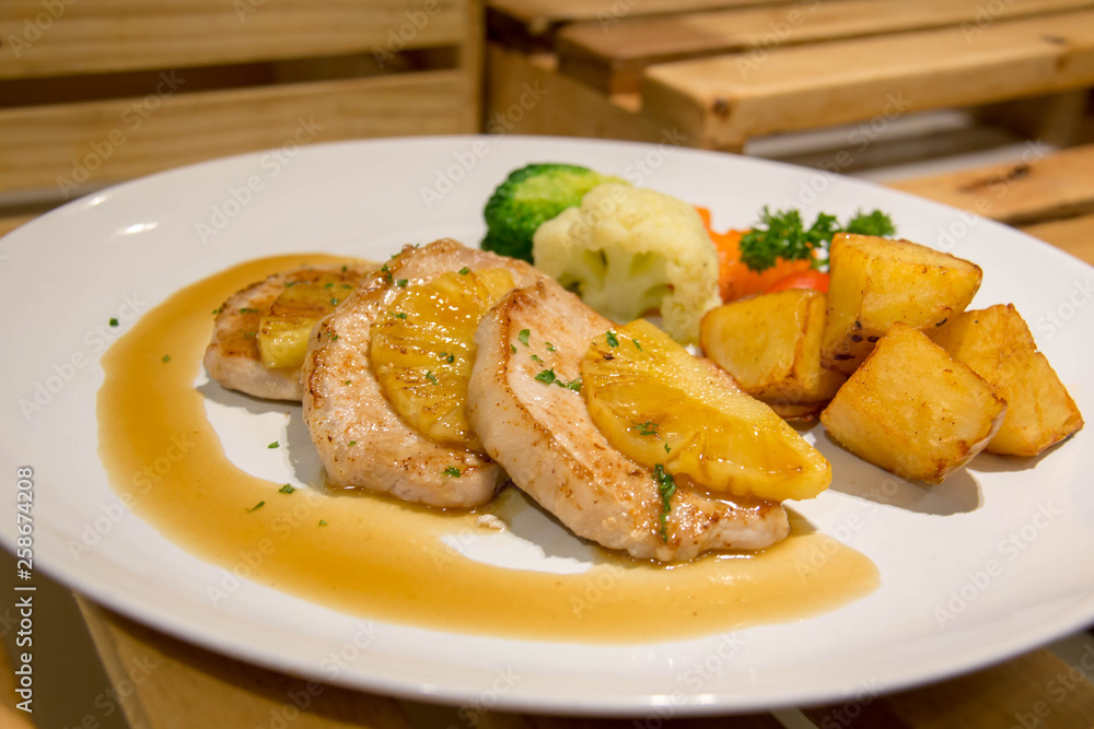 delicious pork steak on white plate delicious pork steak on white plate