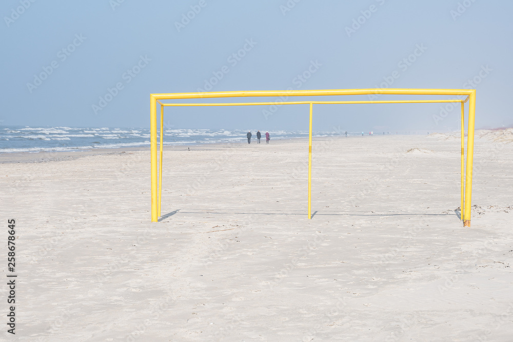 Yellow football goal on the beach. Yellow football goal on the beach.