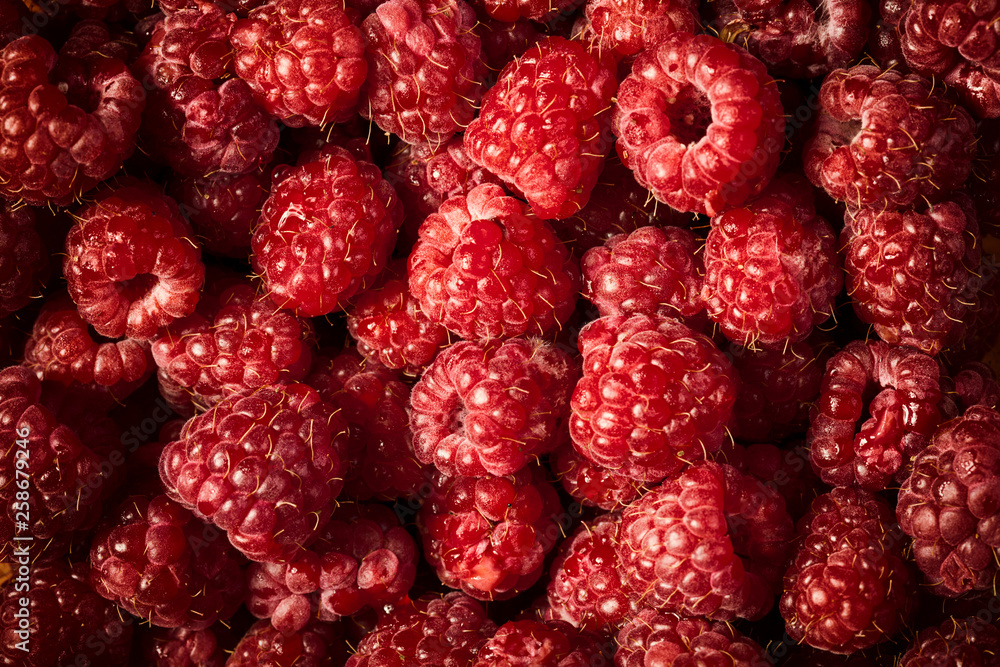 Close up photo of delicious raspberries all mixted together Close up photo of delicious raspberries all mixted together