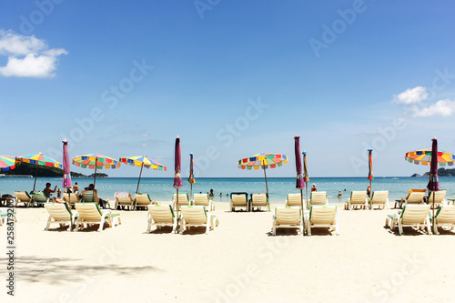 Seascape, picture of beach chairs and beach umbrellas (booth up color process)