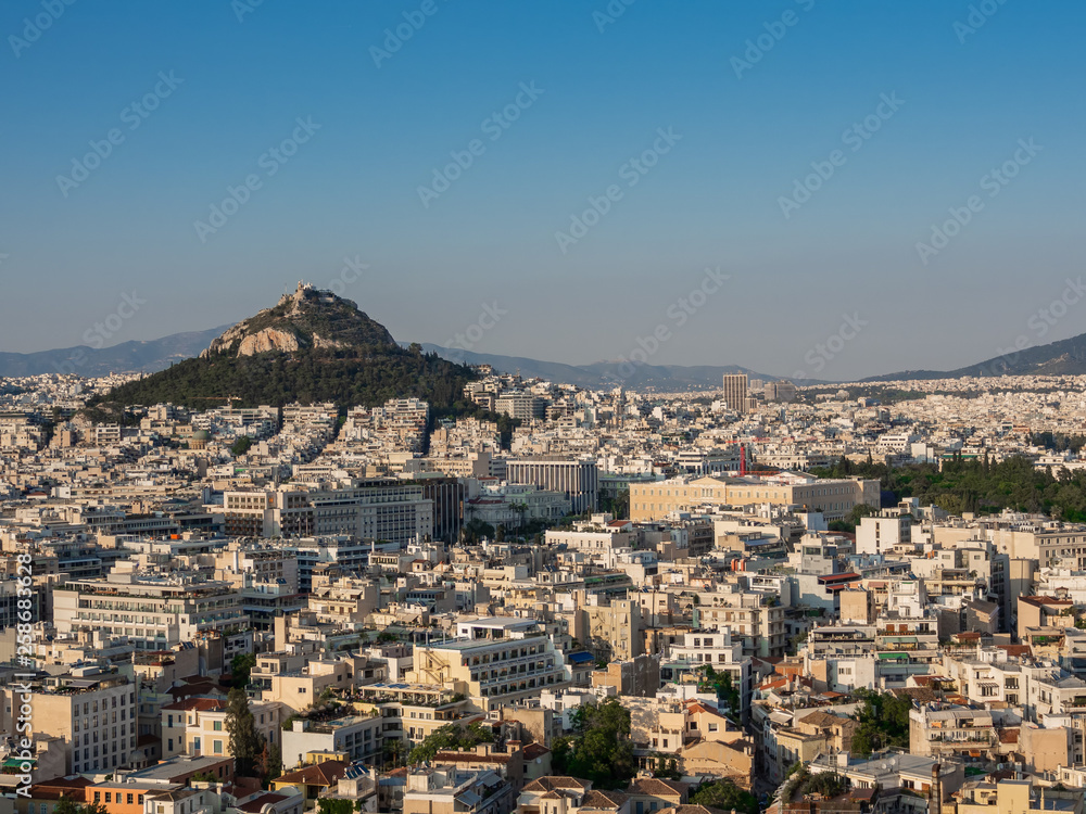 View of Athens, Greece and mount of Lycabettus from Acropolus at sunset