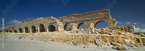 Part of the remains of the Herodian aqueduct near the ancient city of Caesarea, Israel, panoramic view