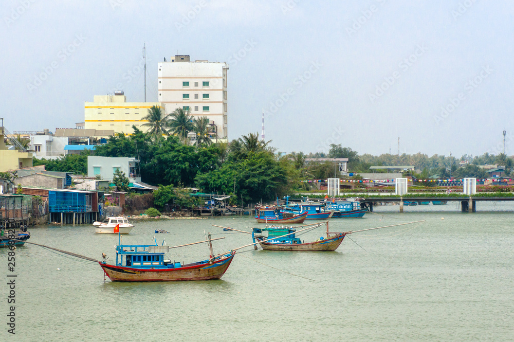 Traditional colorful fishing boats on the river Cai in Nha Trang, Vietnam Traditional colorful fishing boats on the river Cai in Nha Trang, Vietnam