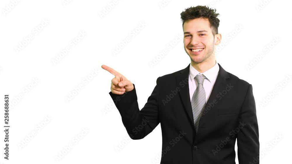 Portrait of a young manager pointing to the left using his index finger, isolated over white Portrait of a young manager pointing to the left using his index finger, isolated over white