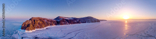 Khoboy (Cape Khoboy) in winter sunset. Russia, Lake Baikal, Olkhon Island. The northernmost point of the island of Olkhon. Aerial Photography Panorama