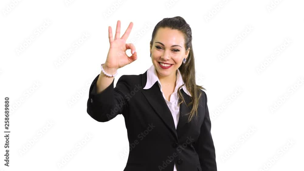 Young business woman indicating ok sign. Isolated over white background Young business woman indicating ok sign. Isolated over white background