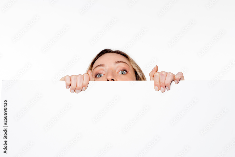 woman hidden behind white panel - close up woman hidden behind white panel - close up