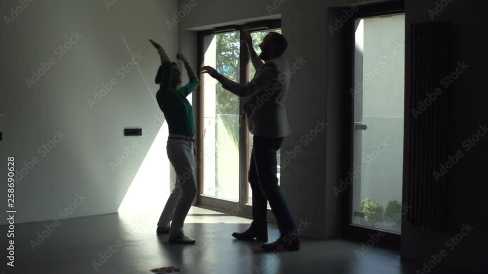 Excited young couple at their new apartment Excited young couple at their new apartment