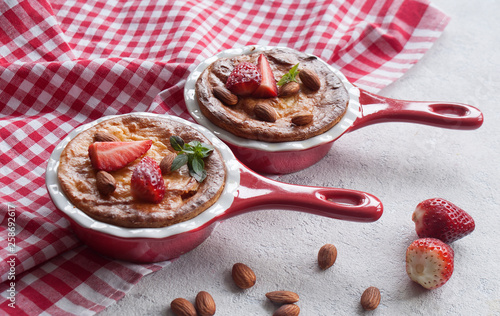 Wallpaper Mural Homemade cottage cheese pudding or casserole with strawberries and almonds in small ceramic pans. Torontodigital.ca