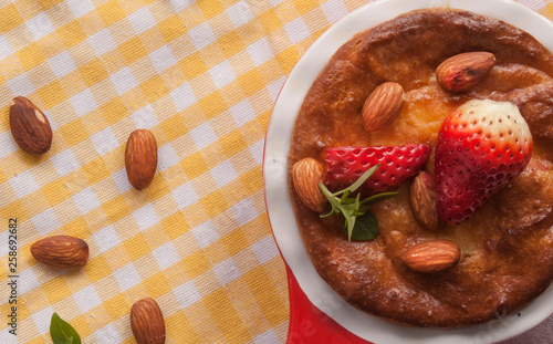 Wallpaper Mural Homemade cottage cheese pudding or casserole with strawberries and almonds in small ceramic pan. Copy space. Torontodigital.ca