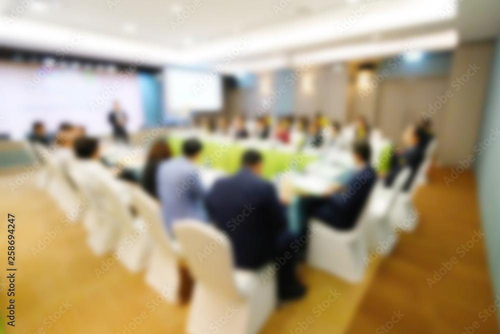 Blurred background of business people in conference hall or seminar room.