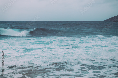 Retro vintage background image of ocean waves from the beach