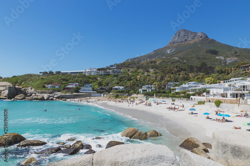 Camps bay beautiful beach with turquoise water and mountains in Cape Town, South Africa photo