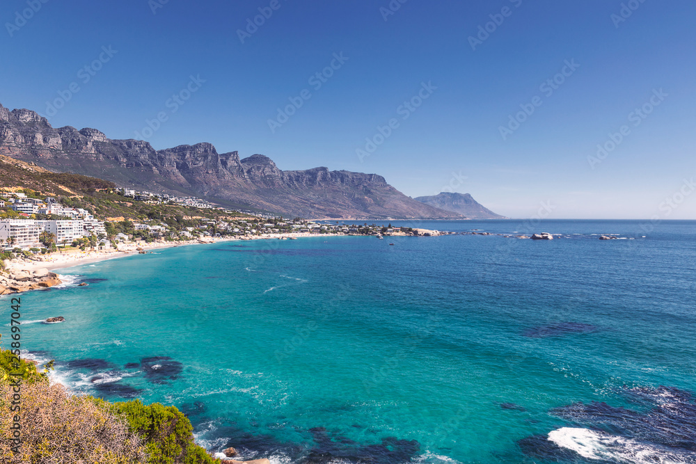 View of Camps bay beautiful beach with turquoise water and mountains in Cape Town, South Africa