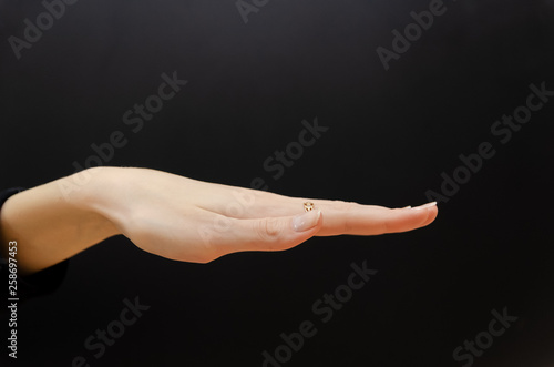inverted female palm on a black background