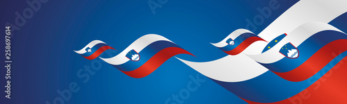 Slovenia Independence Day waving flags two fold blue landscape background