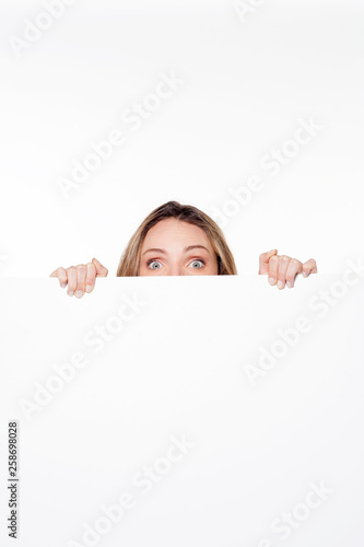 woman hidden behind white panel