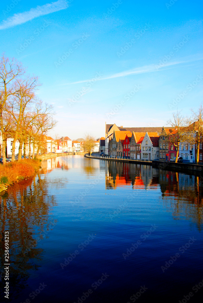 Fototapeta premium Houses near the canals of the river Reie in Bruges. Bruges is a wonderful, romatic city in Belgium, one of the Benelux countries in Europe.