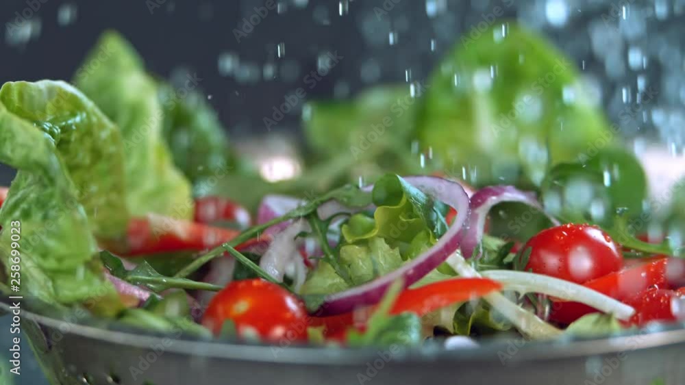 Water falling to fresh salad in super slow motion. Water falling to fresh salad in super slow motion.