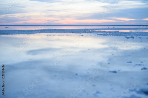 Salt lake. Elton. Footprints in the sand.
