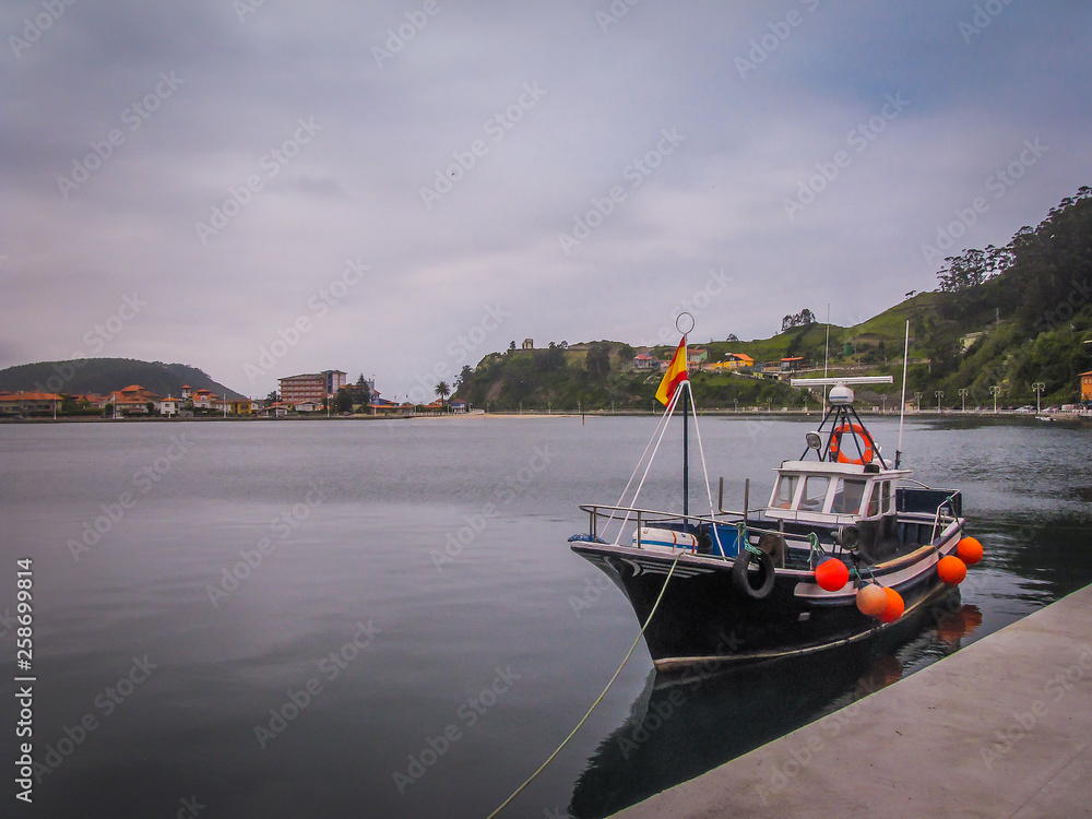 Fototapeta premium old fishing boat on the seaport