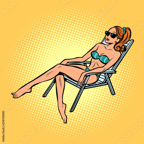 woman in swimsuit sunbathing