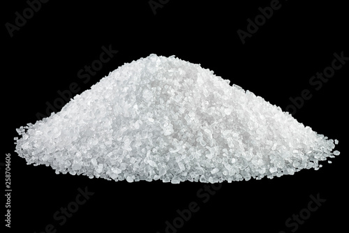Heap of salt isolated on black background
