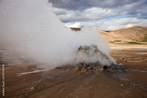 Iceland geothermal zone Namafjall - area in field of Hverir. Landscape which pools of boiling mud and hot springs. Tourist and natural attractions.