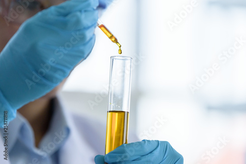 Asian young girl student scientist researching  and learning in a laboratory.