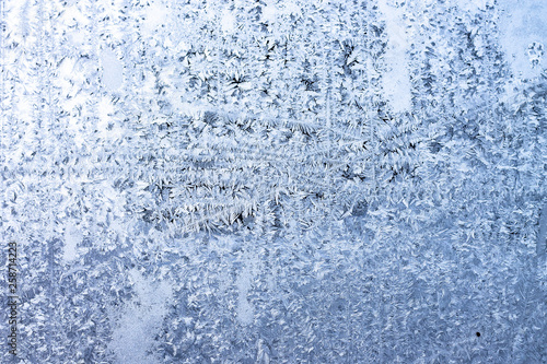 Real ice on frozen window in winter time background © Antti