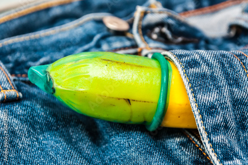 green condom in jeans  photo