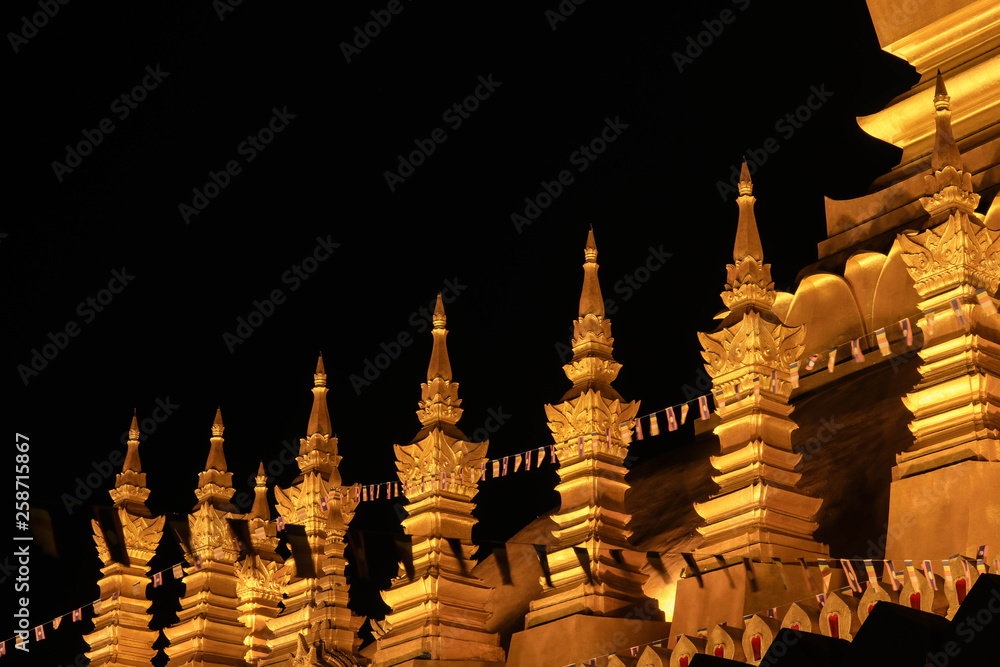 Chedi around Phra Thatluang Stupa(Golden stupa) at night, laos, Vientiane. - Image