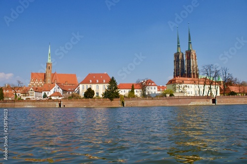 A panorama of a Wroclaw with church and a cathedral next to a river