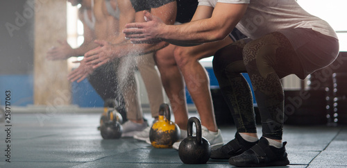 Sporty Male Adults With Chalk Powder During Workout Session.