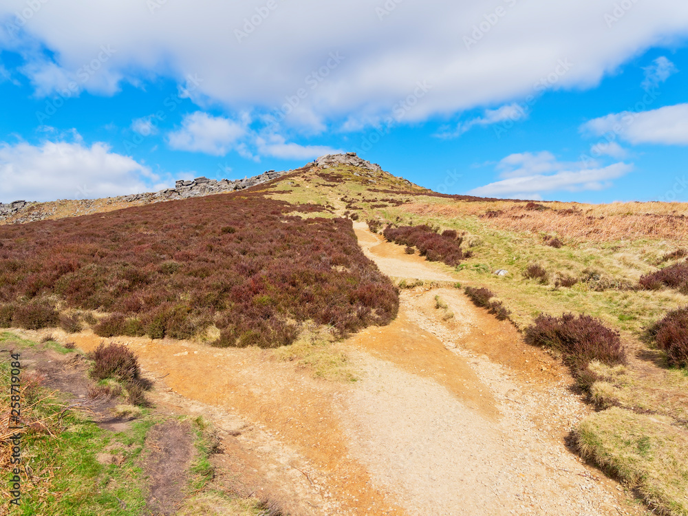 Narrow, steep footpath up to yhe top of Higger Tor in the Derbyshire Peak District. Narrow, steep footpath up to yhe top of Higger Tor in the Derbyshire Peak District.