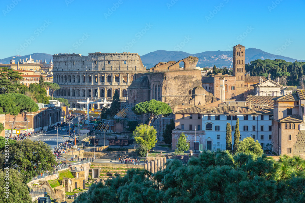 Scenic shot of Rome with Colosseum and Roman Forum, Italy.