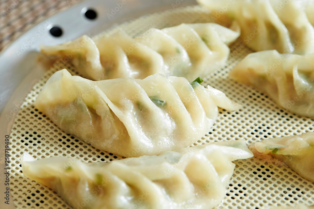 Pork and chives dumpling on steamer Pork and chives dumpling on steamer