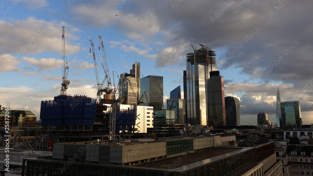 Photo from iconic modern skyscrapers in business district of Bank in the heart of London on a cloudy sky, Great Britain Photo from iconic modern skyscrapers in business district of Bank in the heart of London on a cloudy sky, Great Britain