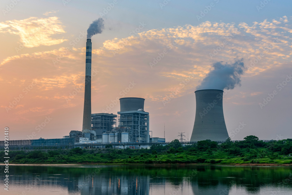 At dusk, the thermal power plants , tops of cooling towers of atomic power plant