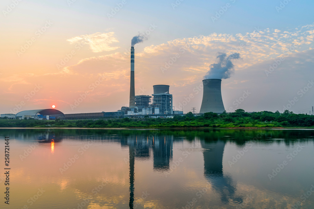 At dusk, the thermal power plants , tops of cooling towers of atomic power plant