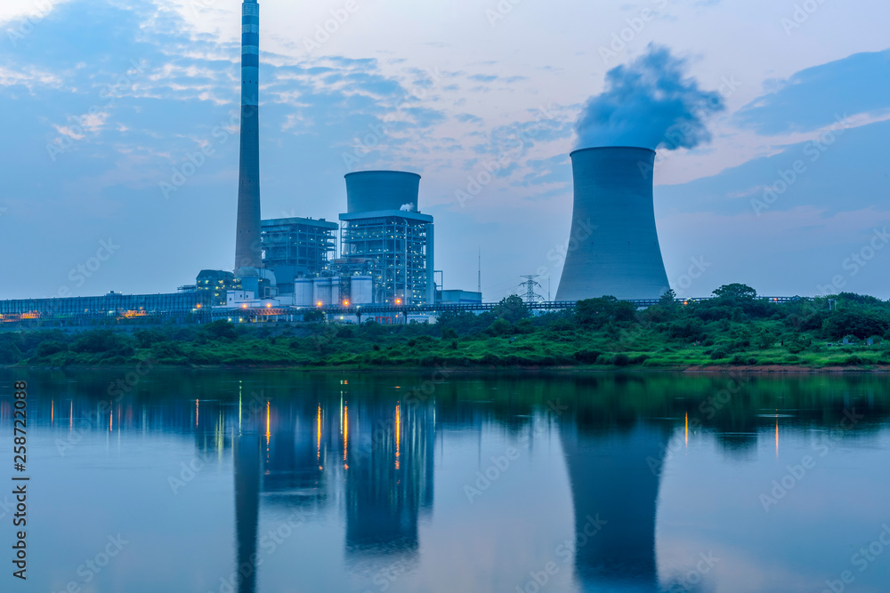 At dusk, the thermal power plants , tops of cooling towers of atomic power plant