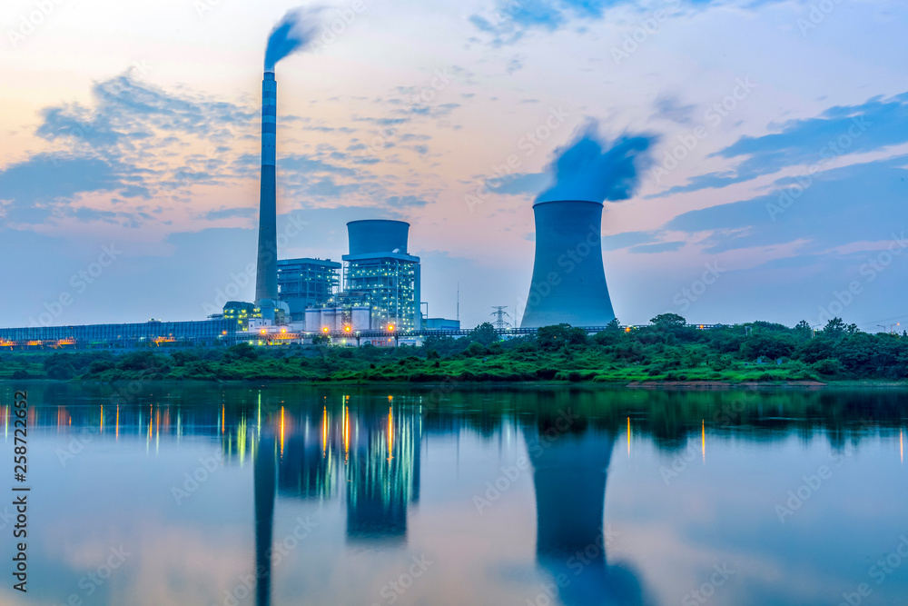 At dusk, the thermal power plants , tops of cooling towers of atomic power plant