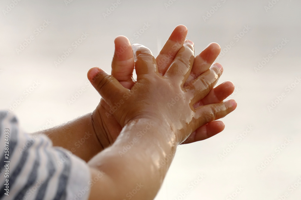 Fototapeta premium Raining into children's hands.